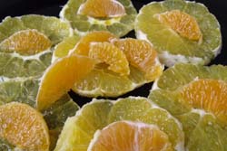 Carpaccio de naranja y mandarina con vinagreta de limón